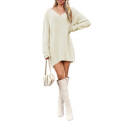 V-Neck Dropped Shoulder Sweater Dress – Cozy Knit Style in light color with stylish boots and handbag.