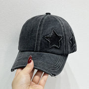 Star Embroidered Baseball Cap featuring distressed star stitching, held in hand for a stylish look.