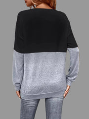 Back view of Crisscross V-Neck Color Block Top in black and grey, showcasing trendy color blocking and modern style.