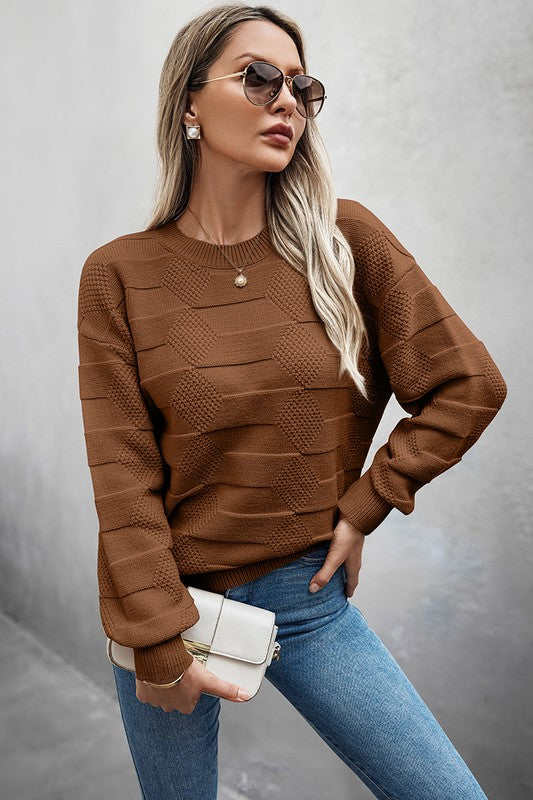 Classic Round Neck Loose Knit Sweater in brown, featuring a relaxed fit, paired with jeans and stylish sunglasses.