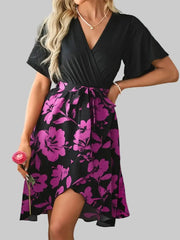 Printed tie-waist mini dress in black and purple floral print – styled with heels