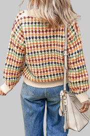 Buttoned Wool Blend Top Back view of a woman wearing a multicolored, cozy sweater with a bag, showcasing a vibrant and stylish look.