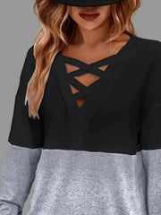 Crisscross V-Neck Color Block Top features a stylish crisscross neckline and a trendy grey and black color block design.