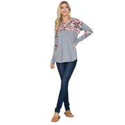 Model wearing a Camouflage Contrast Lightweight Sweater Knit with gray and pink camo detail, paired with jeans.