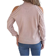 Back view of a woman wearing a Cable Knit Cold Shoulder Turtleneck Sweater, showcasing its stylish design and shoulder cutouts.