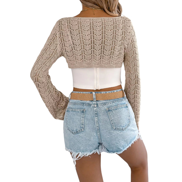 Openwork One-Shoulder Cutout Long Sleeve Sweater – Chic Knit Pullover Top worn with denim shorts, showcasing openwork details.