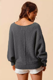 Model wearing the So Me Slouchy Bouclé Sweater in grey, showcasing its cozy texture and relaxed fit.