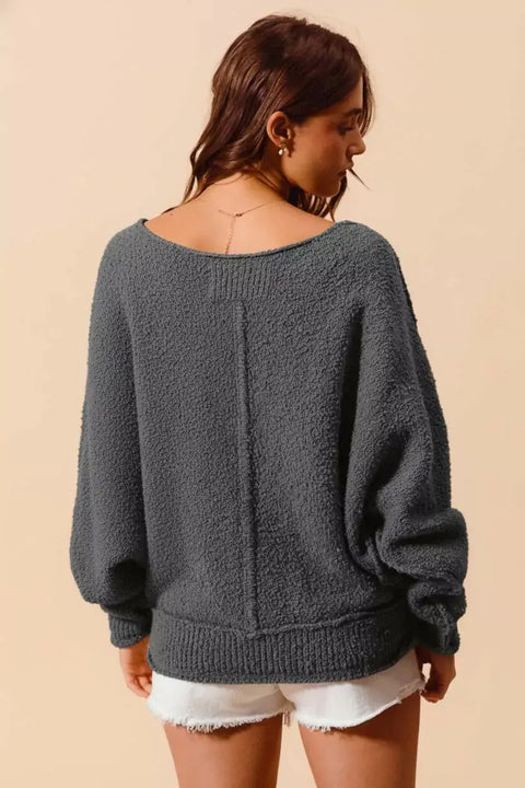 Model wearing the So Me Slouchy Bouclé Sweater in grey, showcasing its cozy texture and relaxed fit.