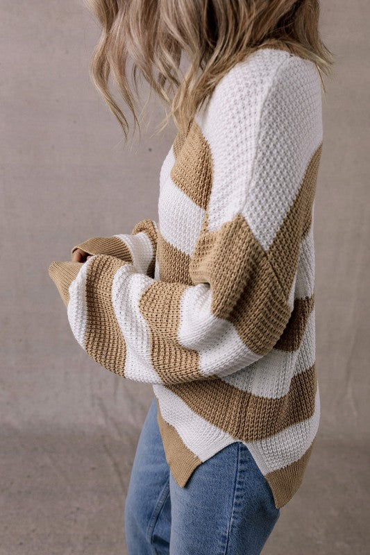 Arabella Striped Side-Slit Knit Sweater in beige and white with drop-shoulder design and side slits.