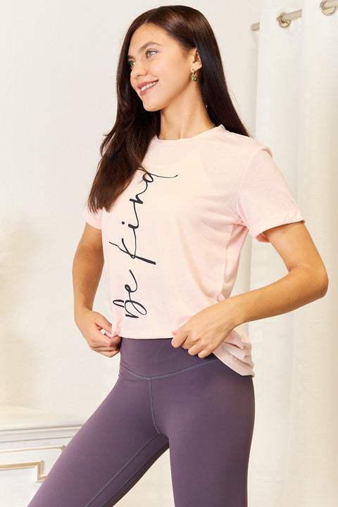 Simply Love Be Kind graphic tee styled with leggings, showcasing comfort and a positive message.
