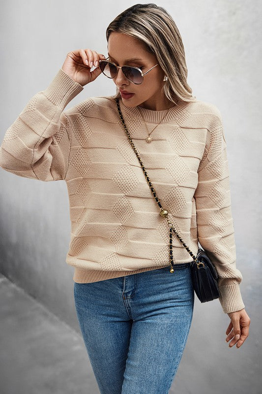 Classic Round Neck Loose Knit Sweater worn with jeans and sunglasses for a casual chic look.