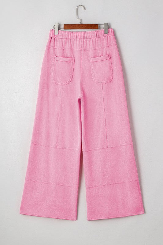 Mineral Wash Reverse Seam Drawstring Elastic Waist cargo pants in pink with adjustable waistband and functional pockets.