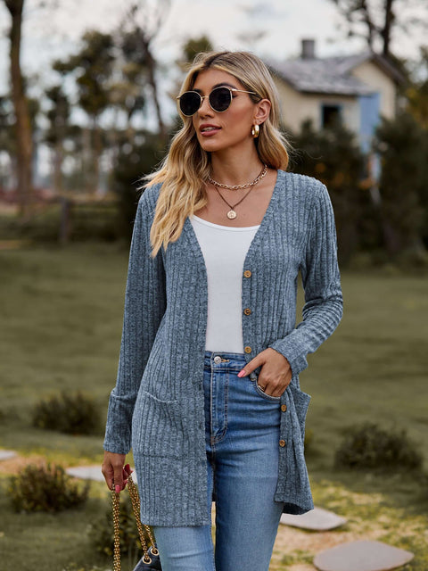 Ribbed Button-Up Cardigan with Pockets worn by a woman, styled casually with sunglasses and a tank top.