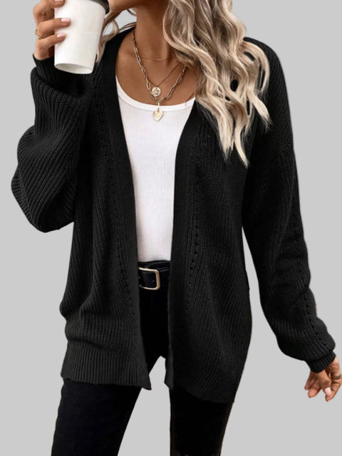 Woman wearing a black Supreme Comfort Open-Front Cardigan over a white top, styled for a chic, casual look.
