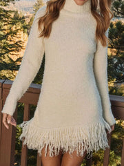 Cozy Fringe Turtleneck Sweater Dress – Long Sleeve Knit featuring a soft white knit and playful fringe hem.