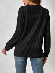 Cozy Open-Front Long Sleeve Cardigan showcased in black ribbed fabric, styled with relaxed fit and long sleeves.
