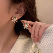18K Gold Snowflake Stud Earrings featuring colorful rhinestones for a festive winter look.