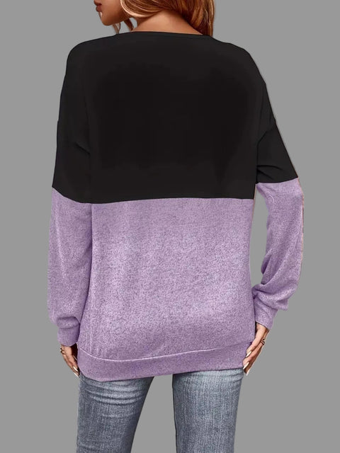 Back view of the Crisscross V-Neck Color Block Top featuring black and lavender color blocks.