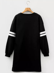 Back view of black Christmas nutcracker sweatshirt dress with white stripes on sleeves.