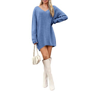V-Neck Dropped Shoulder Sweater Dress – Cozy Knit Style in blue, paired with stylish knee-high boots and chic handbag.