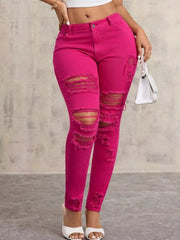 High-Waisted Distressed Skinny Jeans – Classic Denim Fit in vibrant pink with edgy rips and a flattering high-rise.