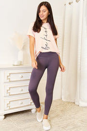 Simply Love Be Kind graphic tee styled with leggings, showcasing comfort and a positive message.