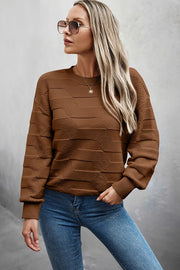 Classic Round Neck Loose Knit Sweater with a textured design in brown, styled with jeans and sunglasses.