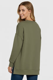 Woman wearing Zenana Fleece Hi-Low Boyfriend Sweatshirt with Pocket in olive green, seen from the back.