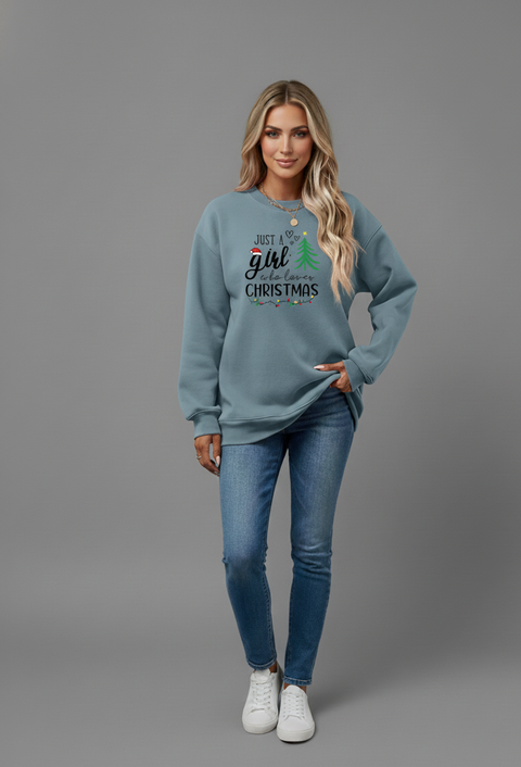 Woman wearing a Letter Graphic Round Neck Sweatshirt with holiday design, styled casually with jeans.