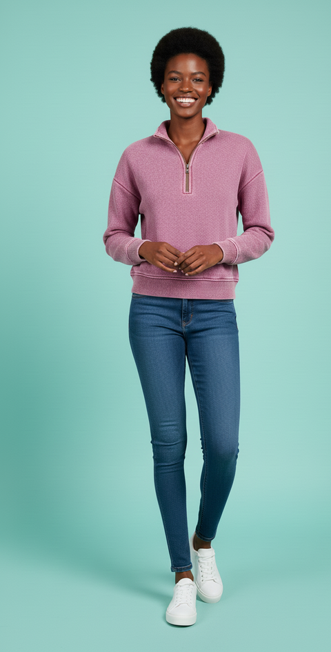 Model wearing the Zenana Acid Wash Fleece Half Zip Sweatshirt in pink with jeans, showcasing its cozy style.