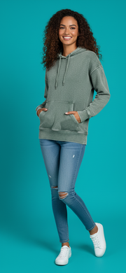 Zenana Fleece Acid Wash Kangaroo Pocket Hoodie worn by a model with curly hair, paired with ripped jeans and white sneakers.