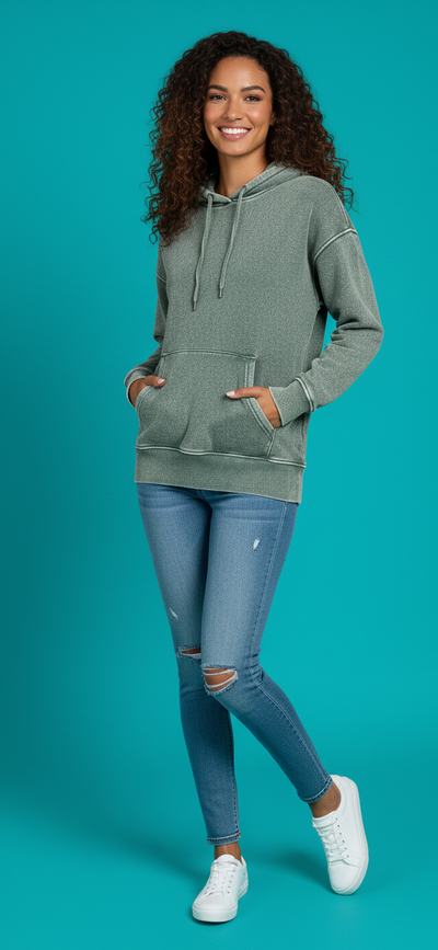 Zenana Fleece Acid Wash Kangaroo Pocket Hoodie worn by a model with curly hair, paired with ripped jeans and white sneakers.