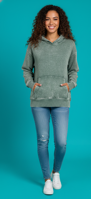 Woman wearing a Zenana Fleece Acid Wash Kangaroo Pocket Hoodie with kangaroo pockets and jeans.