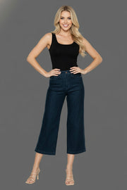 Model wearing Judy Blue Side Seam Braid Crop Wide Leg Jeans with a black tank top on a gray background.