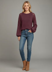 Model wearing the Lace Detail Seam Top featuring lace accents on sleeves for a classic everyday style.