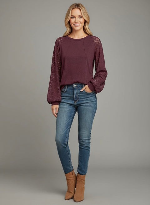 Model wearing the Lace Detail Seam Top featuring lace accents on sleeves for a classic everyday style.