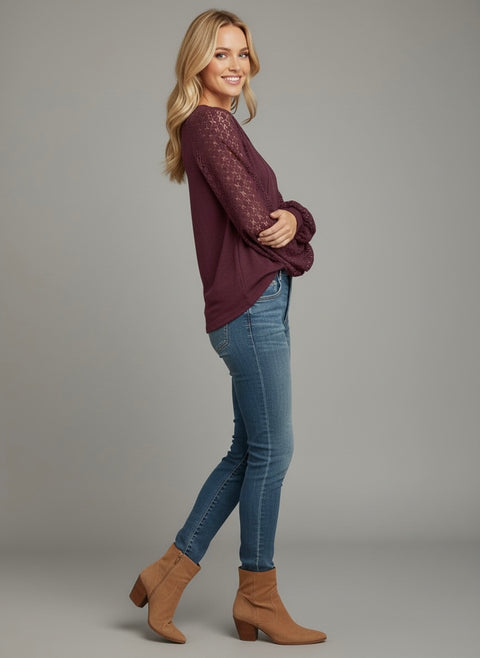 Model wearing the Lace Detail Seam Top featuring lace accents on sleeves for a classic everyday style.