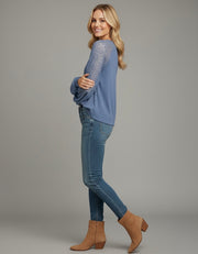 Model wearing the Lace Detail Seam Top featuring lace accents on sleeves for a classic everyday style.