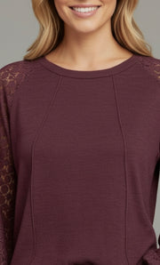 Model wearing the Lace Detail Seam Top featuring lace accents on sleeves for a classic everyday style.