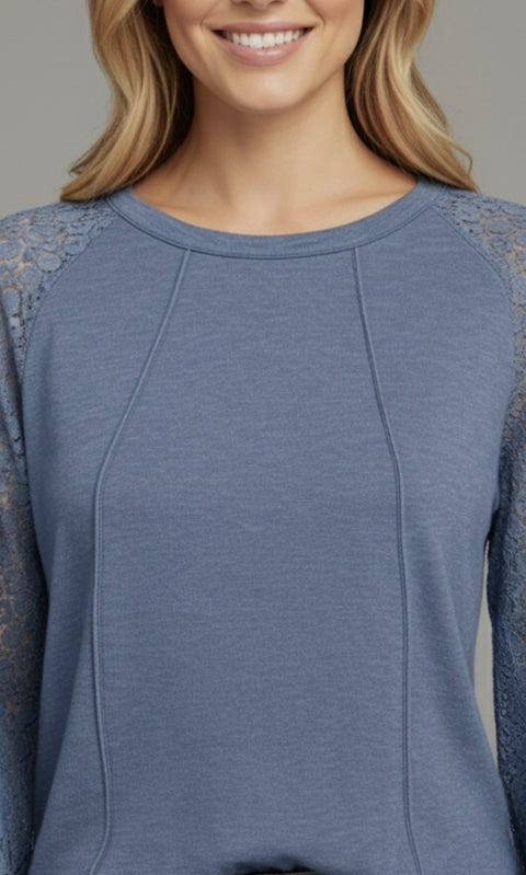 Model wearing the Lace Detail Seam Top featuring lace accents on sleeves for a classic everyday style.