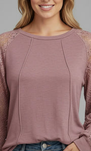 Model wearing the Lace Detail Seam Top featuring lace accents on sleeves for a classic everyday style.