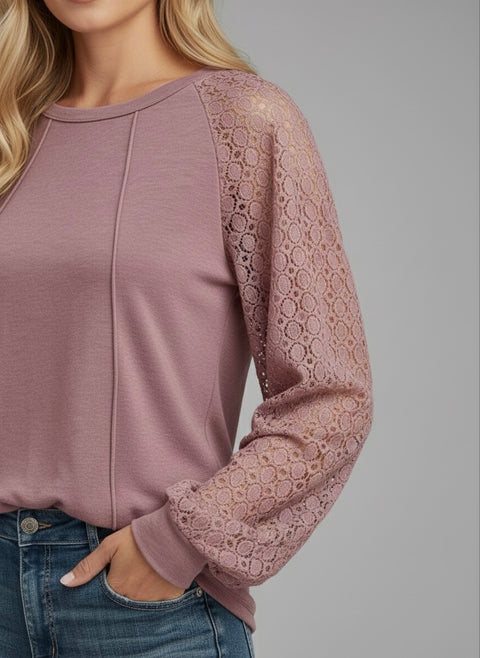 Model wearing the Lace Detail Seam Top featuring lace accents on sleeves for a classic everyday style.
