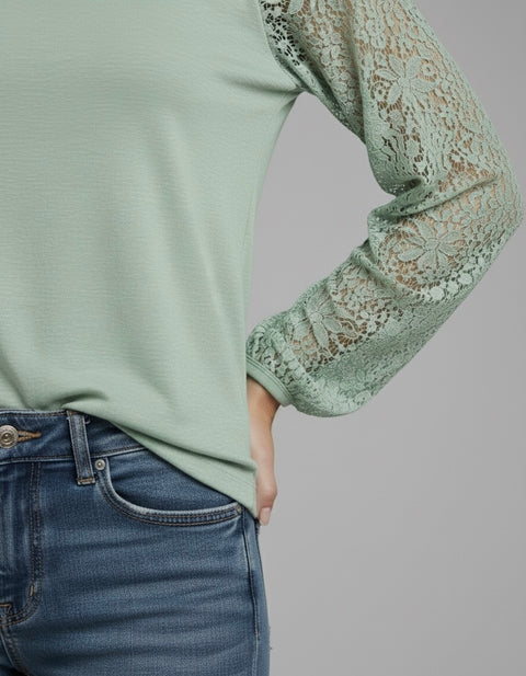 Model wearing the Lace Detail Seam Top featuring lace accents on sleeves for a classic everyday style.