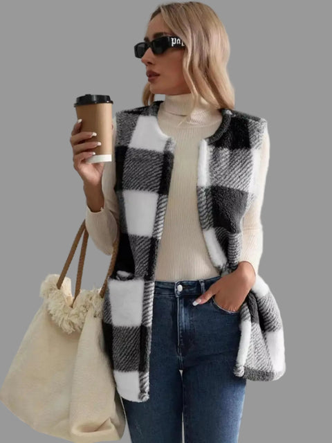 Model wearing a Plaid Sherpa Vest Coat with jeans, holding a coffee cup, showcasing effortless everyday style.