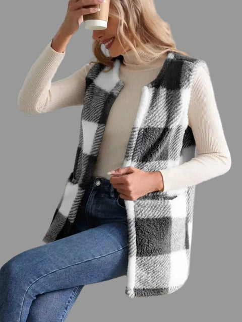 Plaid Sherpa Vest Coat in black and white worn casually with a turtleneck and jeans, perfect for everyday style.