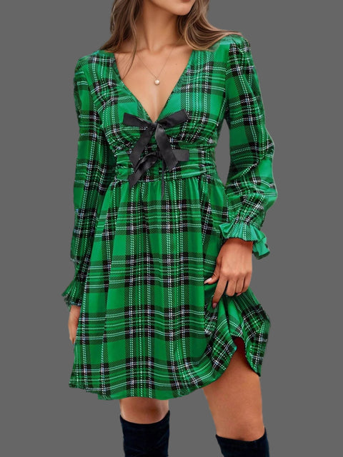 Plaid Holiday Mini Dress – Smocked & Ruffled in green plaid design with bow-tie and ruffled hem.