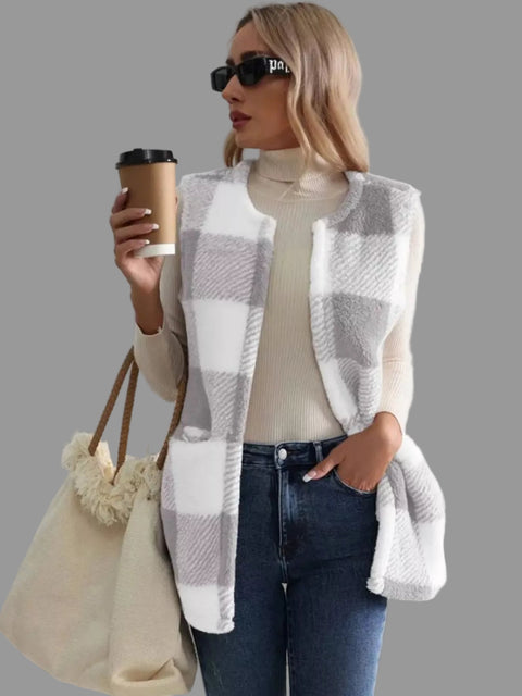 Woman wearing a Plaid Sherpa Vest Coat with a coffee, styled for an effortless everyday look.