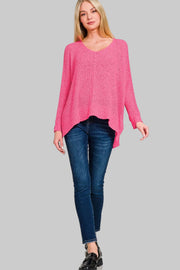 Zenana Dolman Sleeve V-Neck Knit Sweater in pink, featuring a relaxed silhouette, modeled with jeans.