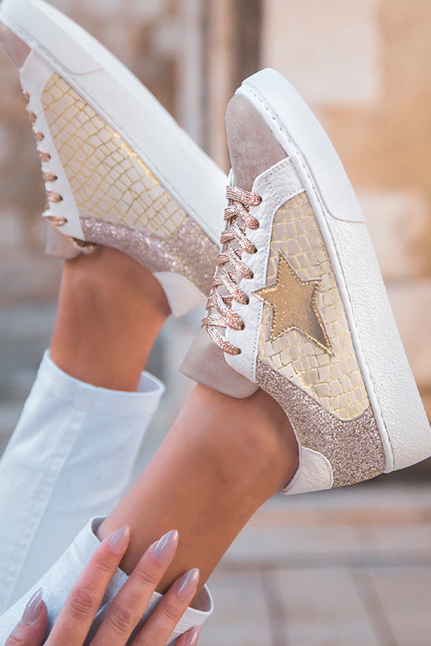 Gold glitter star patchwork sneakers with lace-up design, showcasing stylish accents and trendy aesthetics.