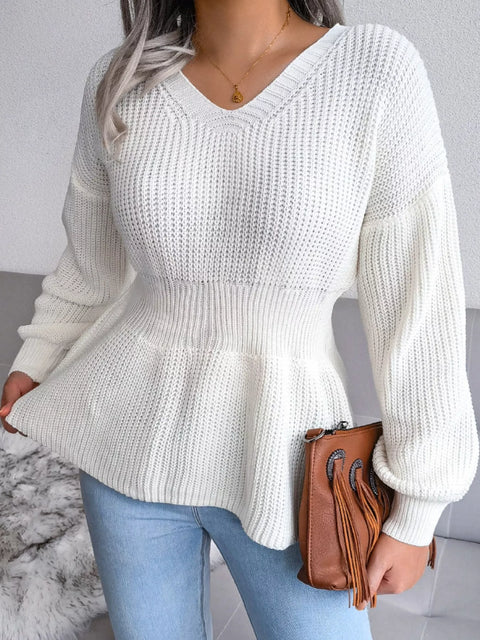 V-Neck Dropped Shoulder Sweater in white with ribbed texture and peplum design, styled with denim and a brown bag.
